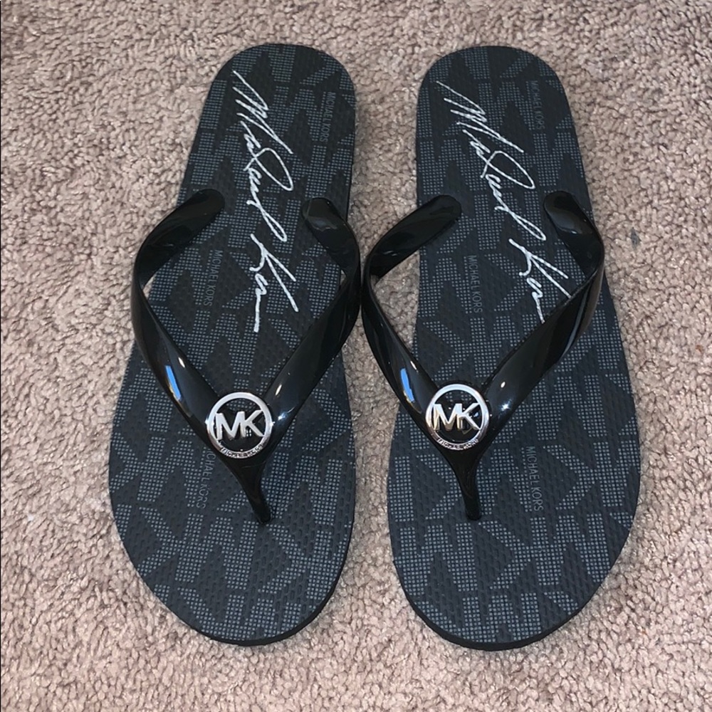 Michael Kors flip flops, size 9